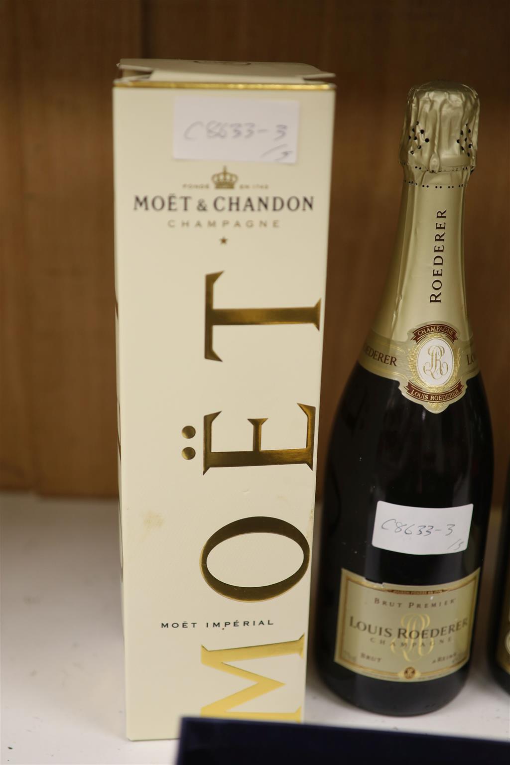 Four bottles of NV Champagne and  Maiily Millennium Champagne with two glasses